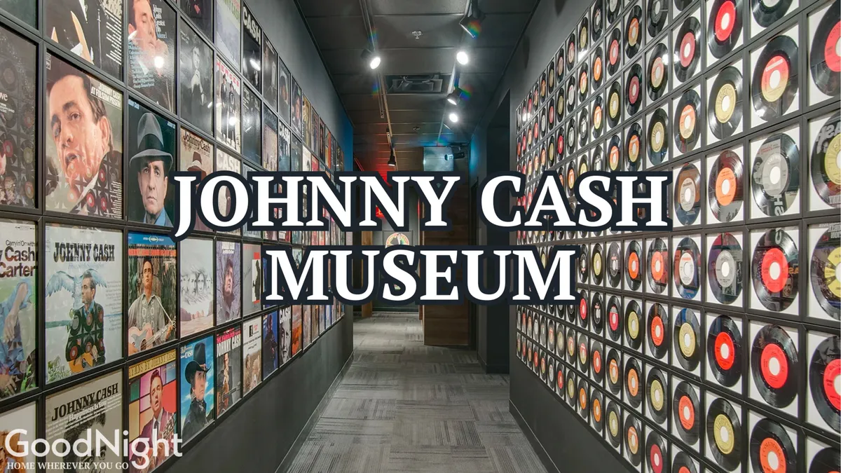 An interior museum scene showcasing a wall of vinyl records, framed album covers, and clear signage related to Johnny Cash. The space is interactive and immersive, inviting visitors to delve into music history.