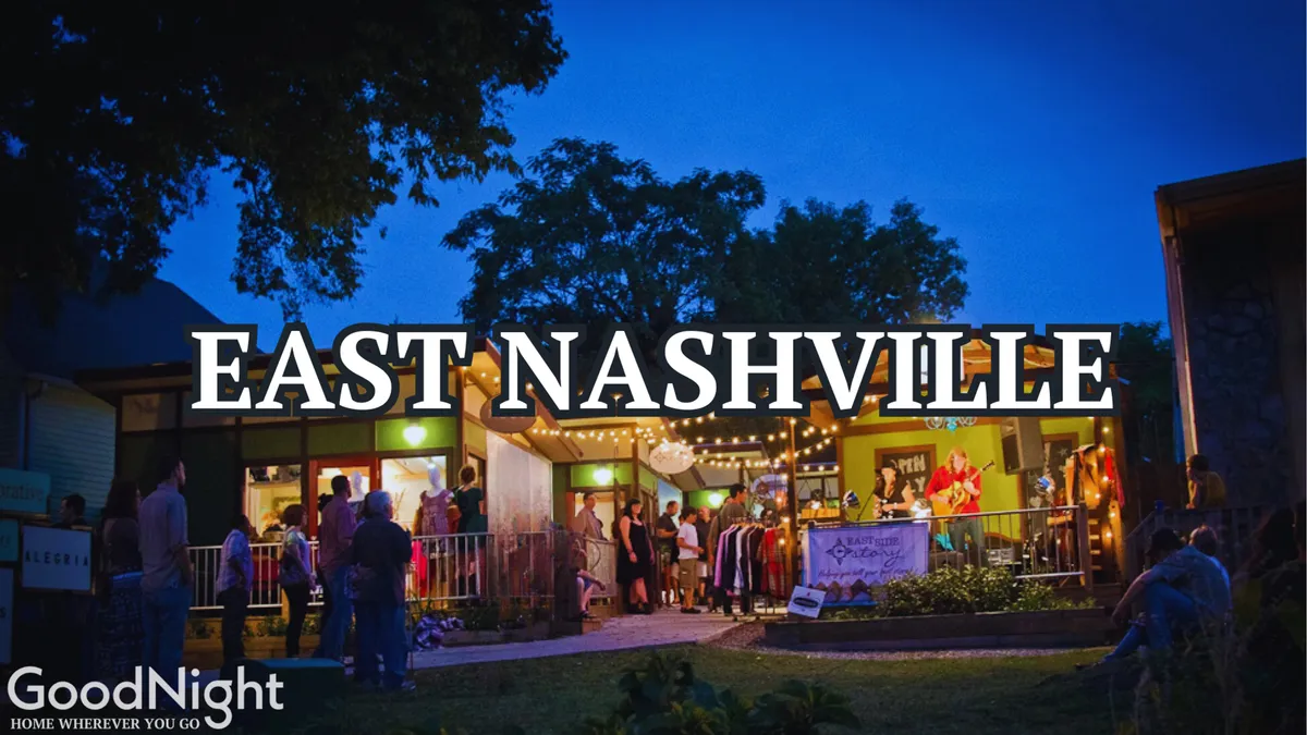 A vibrant streetscape showing a local storefront lit by string lights, with groups of people mingling outside. The scene exudes a lively neighborhood energy, capturing the essence of local shopping, socializing, and live music. It visually reflects the walkable, community-focused atmosphere central to East Nashville.
